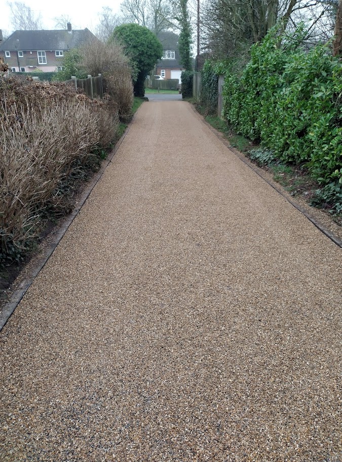 This is a photo of a tar and chip driveway that has been constructed by Anglia Tar & Chip Surfacing